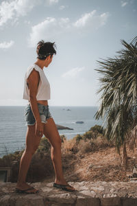 Full length of man standing on beach