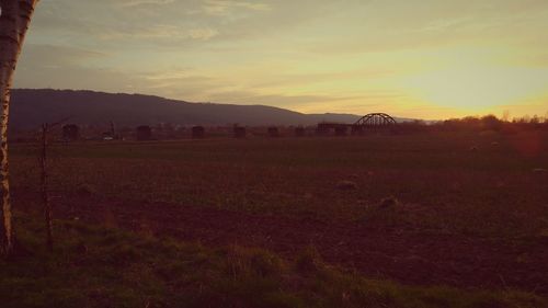 Scenic view of landscape against sky during sunset