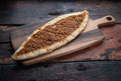 High angle view of bread on cutting board