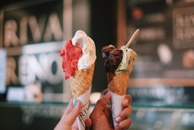 Cropped image of hand holding ice cream cone