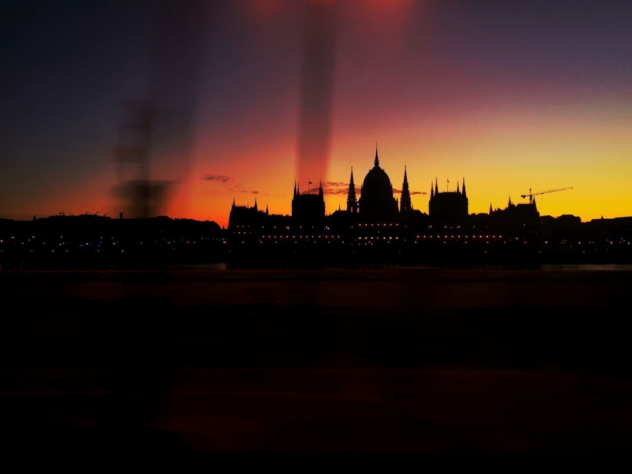 SILHOUETTE OF BUILDINGS AT SUNSET