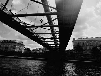 Bridge over river with buildings in background