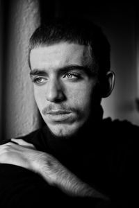 Close-up portrait of young man looking away