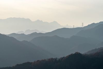 Scenic view of silhouette mountains against sky during sunset