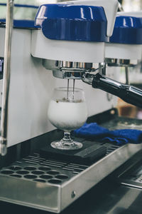 Close-up of coffee preparation in cafe