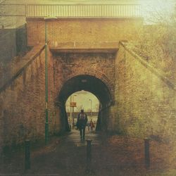 People walking in corridor of building