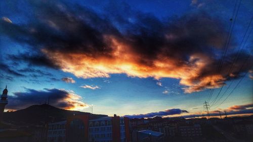 Cityscape against sky during sunset