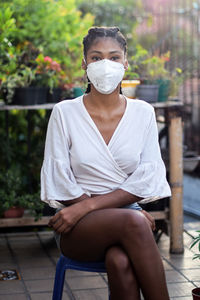 Young black woman in face mask