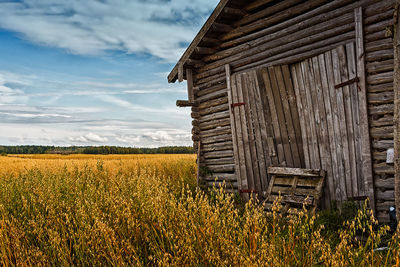 The doors of an old barn house have been closed until the farmer begins the harvest work. 