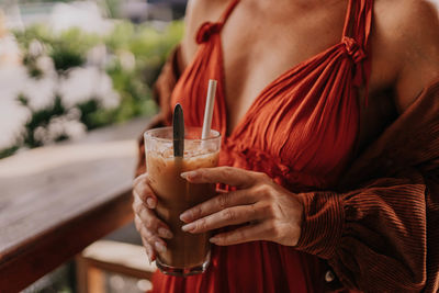 Woman's hands holding coffe close-up