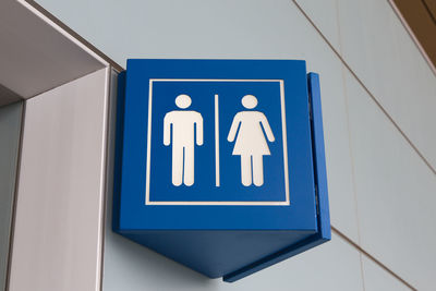 Low angle view of restroom sign