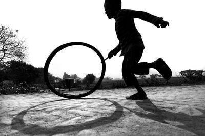 Boy playing with tire