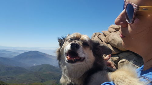 Scenic view of mountains against blue sky