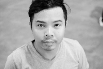 Close-up portrait of smiling young man