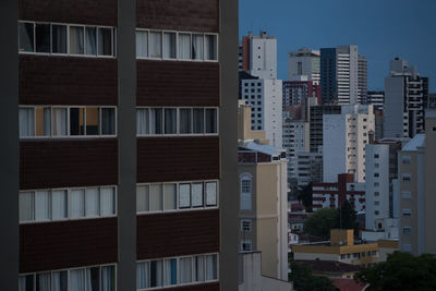 Buildings in city against sky