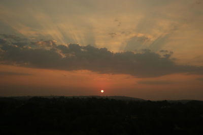 Silhouette landscape against scenic sky