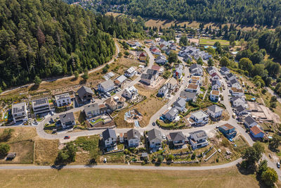 Germany, baden-wurttemberg, bad herrenalb, aerial view of new modern development area in summer