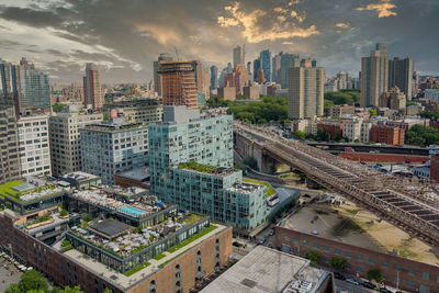 High angle view of buildings in city against sky