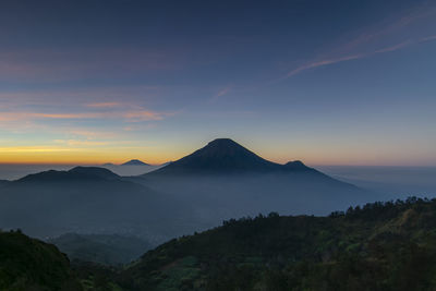 Scenic view of mountains against sky during sunset