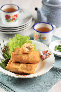 Sosis solo, minced chicken with egg crepe wrap and shape like sausage. 