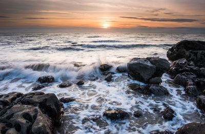 Scenic view of sea against sky during sunset