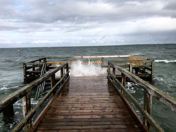 Pier over sea against sky