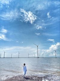 Full length of man on beach against sky