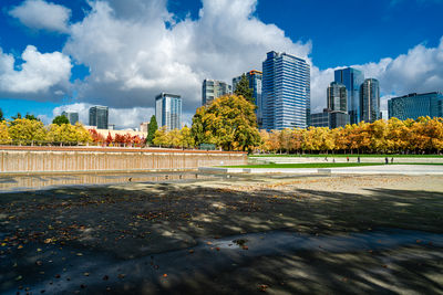 Modern buildings in city against sky