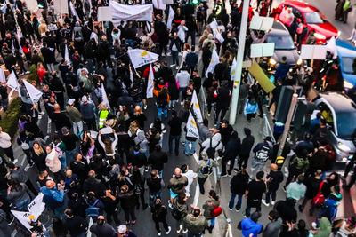 High angle view of people walking on street in city