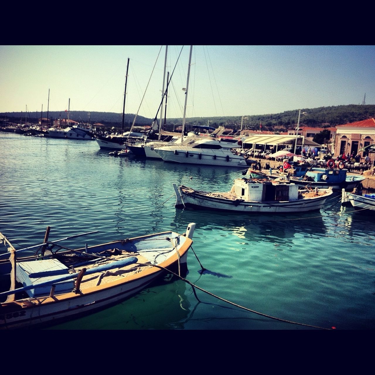 nautical vessel, transportation, boat, water, mode of transport, sea, moored, clear sky, built structure, architecture, building exterior, harbor, waterfront, city, river, copy space, sailboat, blue, sailing, travel