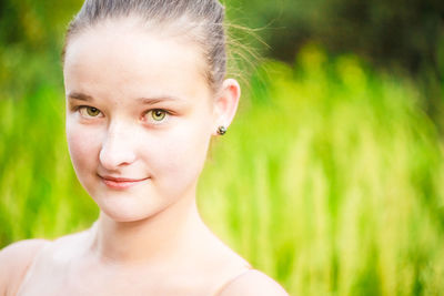 Close-up portrait of smiling young woman