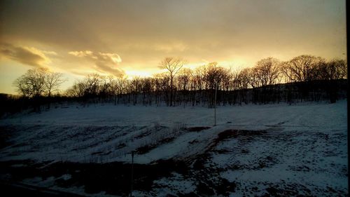 Scenic view of landscape against sky during sunset