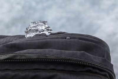 Close-up of ice on backpack