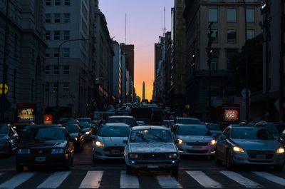 Traffic on city street at dusk