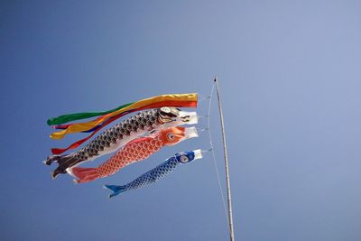 Low angle view of fish against sky