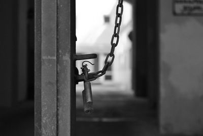 Close-up of chain hanging on metal