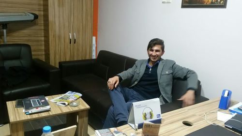 Portrait of man sitting on chair