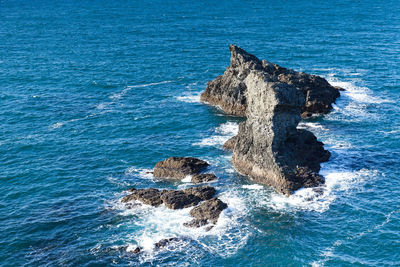 High angle view of rock formation in sea