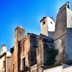 Low angle view of building against blue sky