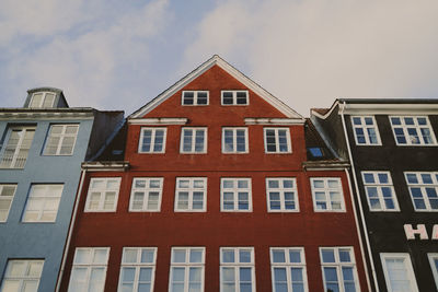 Apartment buildings in city under sky