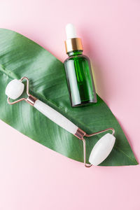 Close-up of beauty products against white background