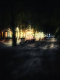 Blurred motion of illuminated street in city at night