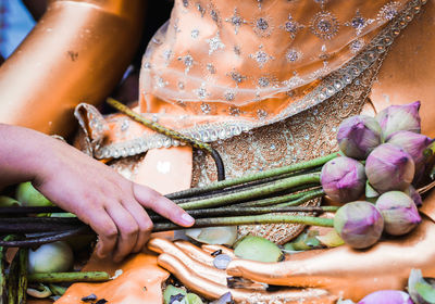 Close-up of hand holding vegetables