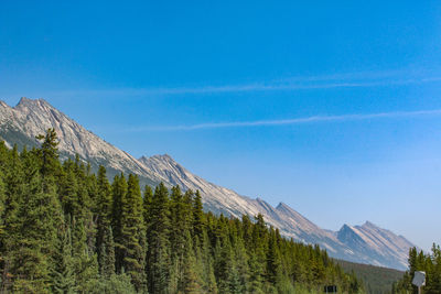 Low angle view of mountains against blue sky