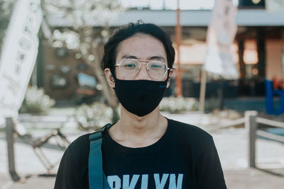 Portrait of teenage girl standing outdoors