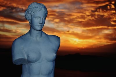 Statue against sky during sunset