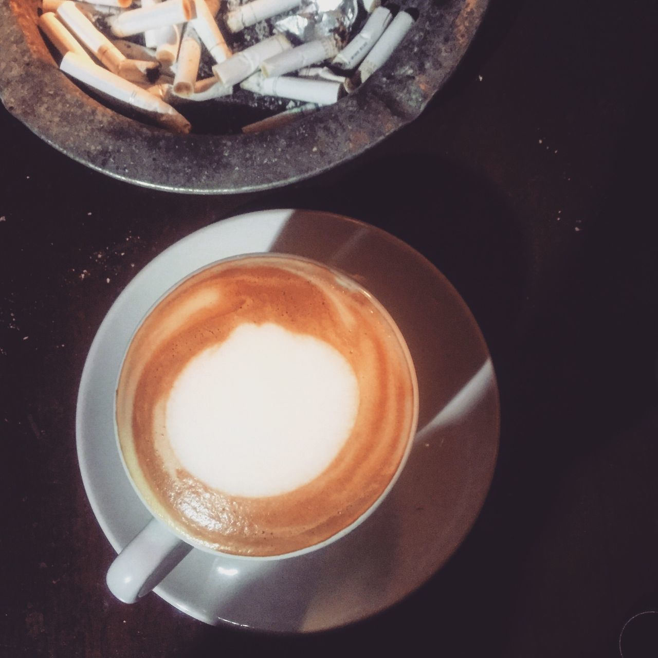 coffee cup, drink, food and drink, indoors, saucer, refreshment, coffee - drink, table, freshness, high angle view, coffee, still life, frothy drink, cup, spoon, cappuccino, directly above, close-up, froth art, no people