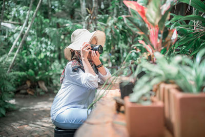 Rear view of man photographing