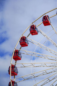 Low angle view of ferris wheel against sky