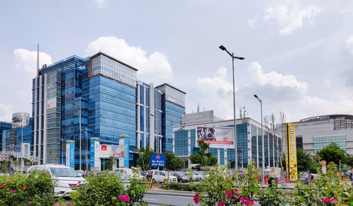 Street amidst buildings in city against sky